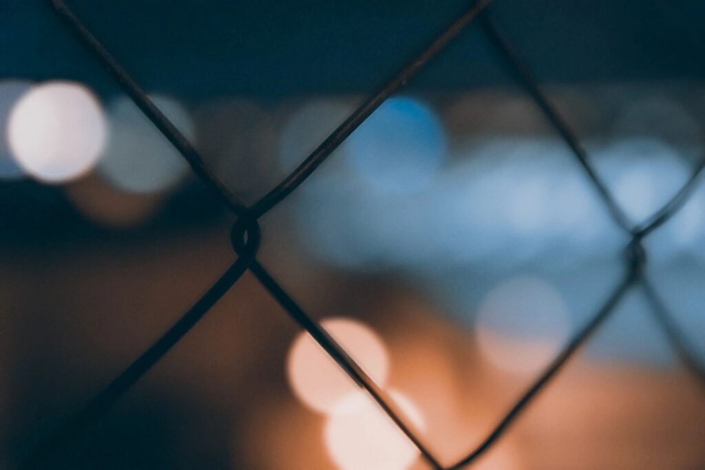 A close-up shot of a chain-link fence